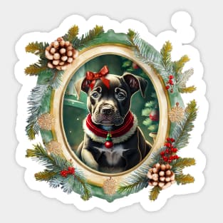 A cute black puppy dog wearing a festive bow and dog collar, in a winter Christmas picture frame with pinecones and winter berries Sticker